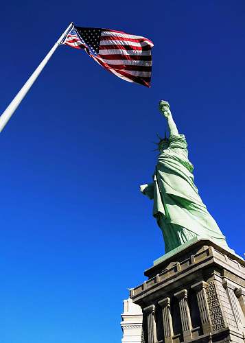 las vegas Statue of Liberty in front USA flag under blue sky blue